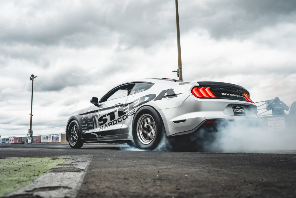 Edelbrock-supercharged Steeda Silver Bullet Mustang GT burnout at dragstrip
